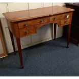 An early 20th century mahogany side table, with an arrangement of four drawers around a kneehole, on