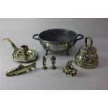 A Depose brass chamber stick, two brass pipe tampers, brass bell and models of a fish and Fo dog,