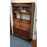 A pair of Minty Oxford oak sectional library bookcases with two levels of lead glazed doors above