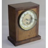 An early 20th century satinwood cased mantle clock, in rectangular shaped case, cream enamel dial