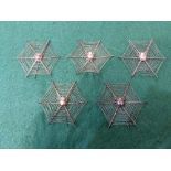 A set of five unusual spider's web table place setting / menu holders each with filigree wire web