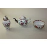 A small Chinese porcelain tea pot with cast metal spout decorated with crysanthemums, a small