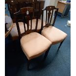 A set of four Edwardian inlaid dining chairs with baluster splat on tapered legs