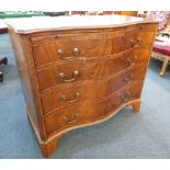 A mahogany serpentine chest of four graduated drawers with brushing slide and brass drop handles, on