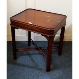 A reproduction mahogany side table with rectangular cut corner top and single drawer on square