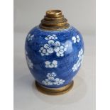 A gilt metal mounted Chinese blue and white porcelain vase, decorated with blossom, the mount