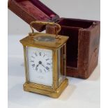 A brass and bevelled glass cased carriage clock, the dial marked J C Vickery, to their Majesties,