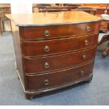 A 19th century mahogany and inlaid bowfront chest of four graduated drawers, with cast brass ring