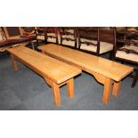 A pair of pale oak benches, each with rectangular top on square legs, 180cm long