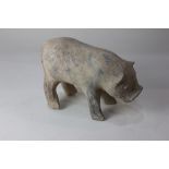 A Chinese pottery model of a pig, possibly Han Dynasty, 18cm high (a/f)