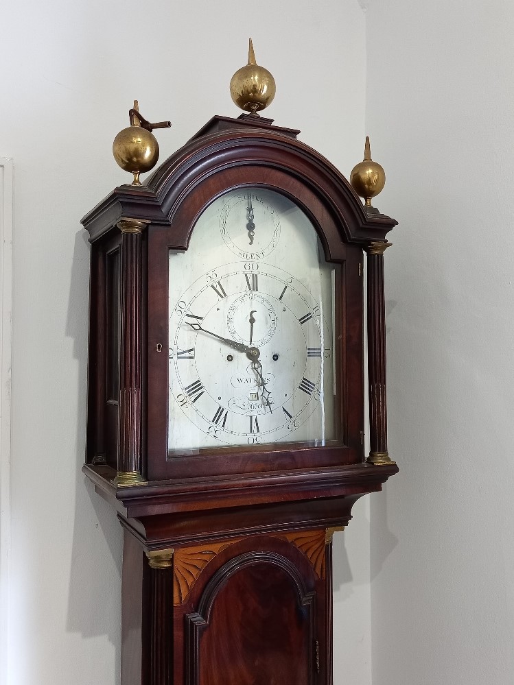 A George III mahogany inlaid longcase clock the silvered dial signed 'Watkins London', with strike /