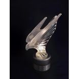 A Lalique Mclaren limited edition clear crystal sculpture of a falcon, from the Essence of Speed