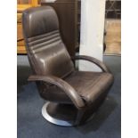 A Danish Berg Ergo Line brown leather reclining armchair, on circular base (a/f)