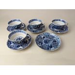 A set of four blue and white porcelain tea cups and five saucers, probably Royal Worcester, with
