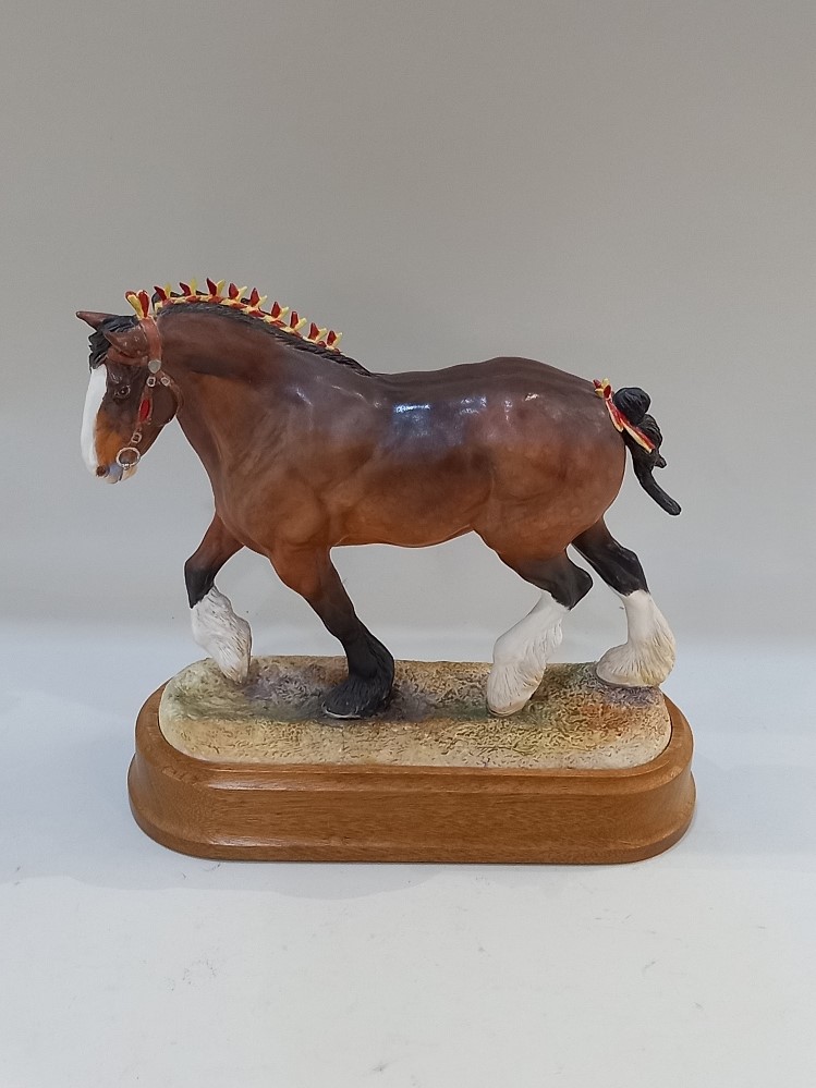 A Hereford China model of a Shire horse on oval wooden base (a/f) 28cm