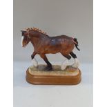 A Hereford China model of a Shire horse on oval wooden base (a/f) 28cm