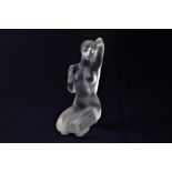 A Lalique crystal figure of a kneeling nude with one arm raised 'Aphrodite', 12.5cm, boxed