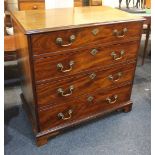 A George III mahogany chest of four graduated drawers with brass swan neck drop handles, on