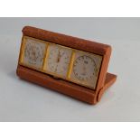 An Angelus 'Threesome' gilt metal three dial travel set of clock, barometer and calendar in brown