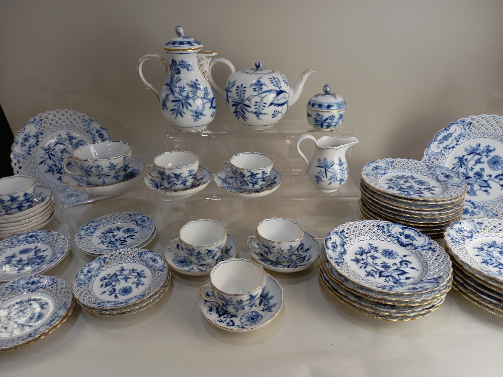 A matched collection of Meissen porcelain onion pattern tea and table wares, to include teapot, milk