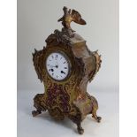 A 19th century French gilt metal mounted boulle mantle clock with eagle finial, striking on a