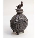 A metal gunpowder flask, possibly Turkish (a/f)