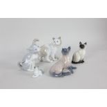 A Royal Copenhagen porcelain model of a cat, 10.5cm high, together with four various porcelain