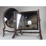 An oval mahogany dressing table mirror on skeleton frame, 60cm high and a rectangular dressing table