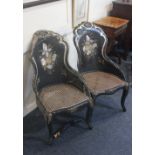 A Victorian papier mache ebonised salon chair with mother of pearl inlay, floral painted