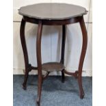 A mahogany circular occasional table with scalloped border on cabriole legs with platform stretcher,
