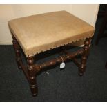 An oak leather upholstered stool with block and turned supports 50cm