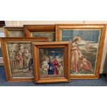 A collection of five framed woolwork pictures mostly Biblical subjects, to include an example with