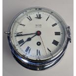 A 20th century 'Smiths Astral' ships bulk head type clock, with key