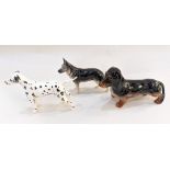 Three Beswick models of dogs; a Dachshund, a German Shepherd and a Dalmatian, tallest 15.5cm high