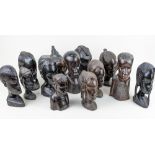 A collection of African carved hardwood busts, largest 22cm high