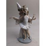 A Lladro porcelain figure group of a clown and a ballerina, 26cm high