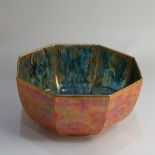 A Wedgwood Fairyland lustre fruit bowl octagonal form with mottled orange exterior decorated with