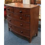 A bowfront chest of two short over three long drawers with knob handles, on splayed bracket feet, (