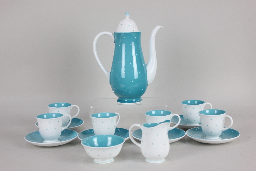 A Susie Cooper porcelain coffee set with green and white spotted pattern, comprising coffee pot,
