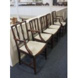 A set of five mahogany dining chairs two carvers and three single, with pierced vertical bar