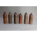 Six German Selters Nassau stoneware bottles stamped with numeral, (a/f) 23cm