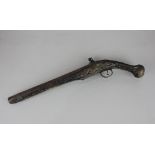 A 19th / 20th century flintlock pistol with brass wire decoration and engraved mounts, (a/f) 51cm
