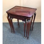 A set of three mahogany side tables with moulded borders on slender cabriole legs 50cm