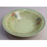 A Bizarre by Clarice Cliff green glazed pottery bowl, with floral decoration, 23cm diameter