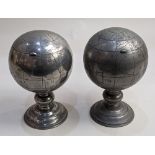 A pair of lidded pewter globes containing canisters, decorated with character marks, 16cm high (a/