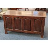 A 19th century oak coffer, the moulded top with hinged lid, above four panel front, on stile