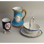 An early 19th century Wedgwood blue and white creamware basket and oval stand, both with impressed