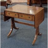 A Regency style mahogany sofa table rectangular top with crossbanding and black line inlay, two drop