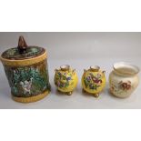 A pair of Royal Worcester porcelain globular vases, decorated with birds on flowering branches, on