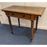 A Victorian mahogany writing table with rectangular tooled green leather top, single drawer and